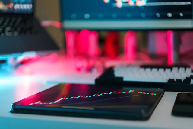 High-tech trading setup with charts on tablet and computer screens, representing data analysis and financial trends. 3 details of marketing mix modeling best practices people miss